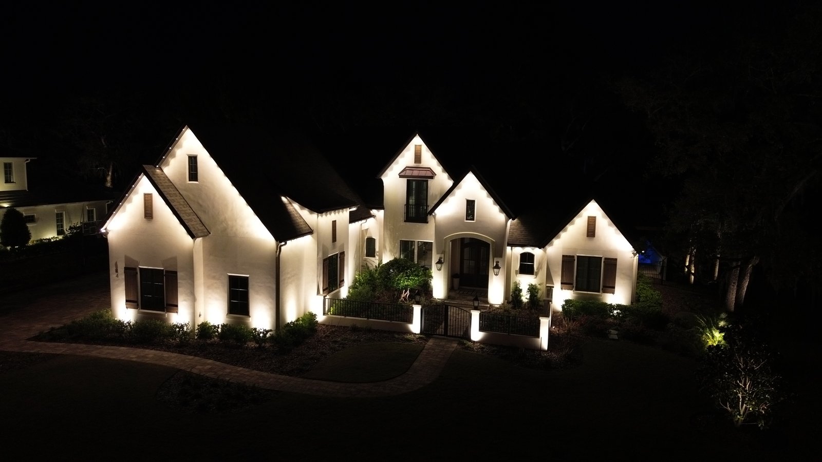 Home at night with Sunshine Lighting Co. permanent architectural lighting installed